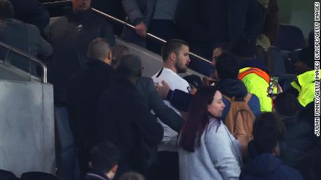 Eric Dier is led away by security after confronting a Tottenham fan following his side&#39;s FA Cup defeat. 