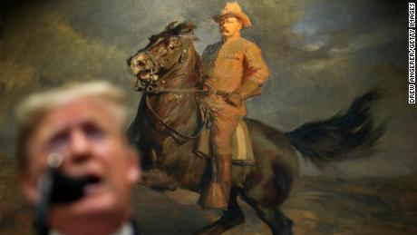President Donald Trump announces changes to the National Environmental Policy Act in front of a portrait of his predecessor, Teddy Roosevelt, who pioneered conservation while in the White House.