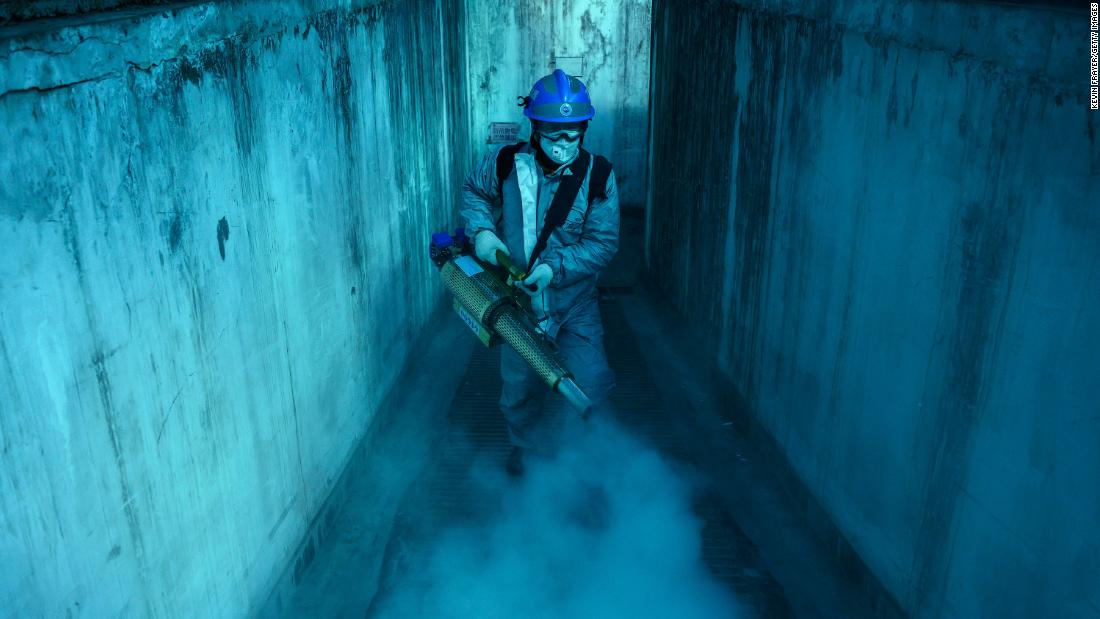 A volunteer from Blue Sky Rescue uses fumigation equipment to disinfect a residential compound in Beijing on March 5, 2020.