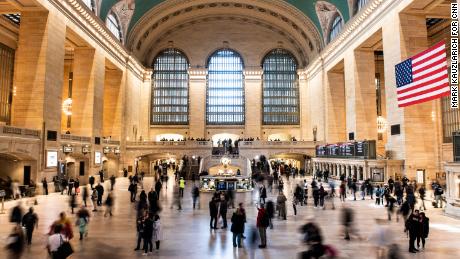 People walk through Grand Central Terminal, a major transit hub. 