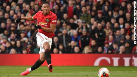 Striker Anthony Martial scores the opening goal for Manchester United.