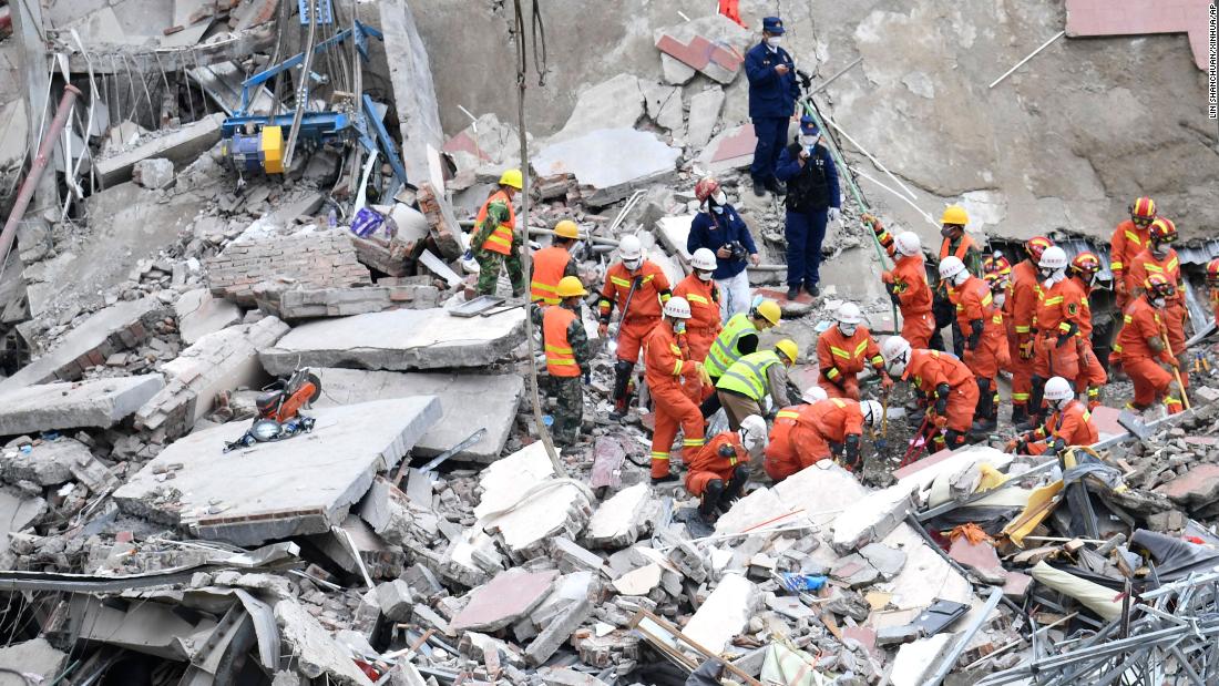 Rescuers search for victims at the site of a &lt;a href=&quot;http://www.cnn.com/2020/03/07/china/china-coronavirus-hotel-collapse/index.html&quot; target=&quot;_blank&quot;&gt;collapsed hotel&lt;/a&gt; in Quanzhou, China, on March 8. The hotel was being used as a coronavirus quarantine center.