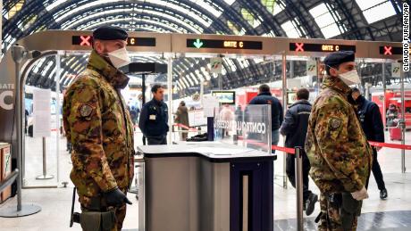 Italian army soldiers patrol the gates of Milan main train station, Italy, Monday, March 9, 2020. Italy took a page from China&#39;s playbook Sunday, attempting to lock down 16 million people — more than a quarter of its population — for nearly a month to halt the relentless march of the new coronavirus across Europe. Italian Premier Giuseppe Conte signed a quarantine decree early Sunday for the country&#39;s prosperous north. Areas under lockdown include Milan, Italy&#39;s financial hub and the main city in Lombardy, and Venice, the main city in the neighboring Veneto region. The extraordinary measures will be in place until April 3. (Claudio Furlan/LaPresse via AP)