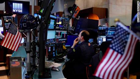 Trader Jonathan Greco prepares for the day&#39;s activity on the floor of the New York Stock Exchange, Monday, March 9, 2020. Trading in Wall Street futures has been halted after they fell by more than the daily limit of 5%. (AP Photo/Richard Drew)