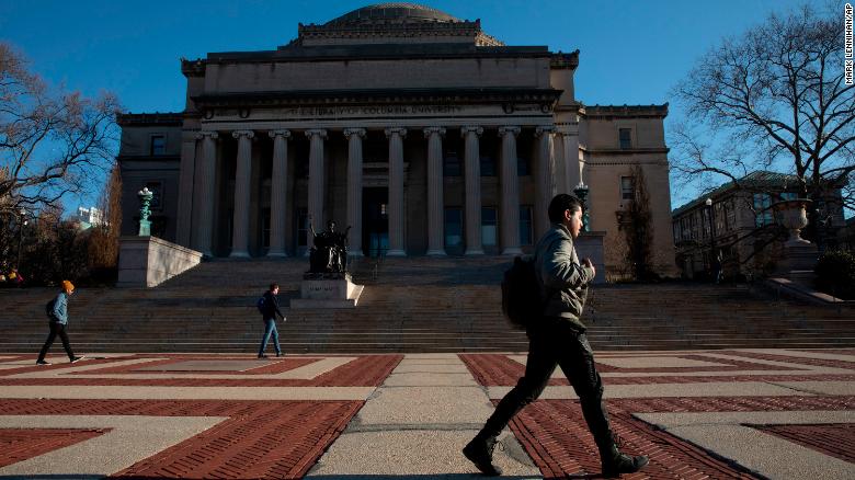 A man walks past Low Library on the Columbia University campus, Monday, March 9, 2020, in New York.
