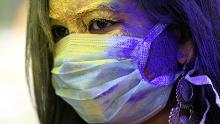 Holi celebrated with face masks and color explosions amid coronavirus fears