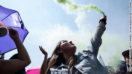 MEXICO CITY, MEXICO - MARCH 08: A demonstrator lights a flare during a rally on International Women&#39;s Day on March 8, 2020 in Mexico City, Mexico. (Photo by Toya Sarno Jordan/Getty Images)
