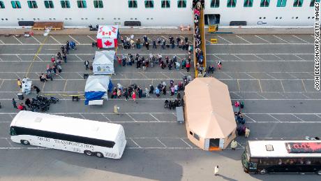 Canadians disembark from the Grand Princess cruise ship at the Port of Oakland in California.