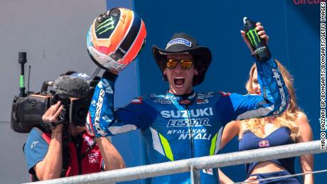Alex Rins celebrates victory on the podium at the end of the MotoGp Red Bull U.S. Grand Prix of The Americas.