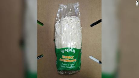 The recalled mushrooms were sold in clear plastic packages with a green label.