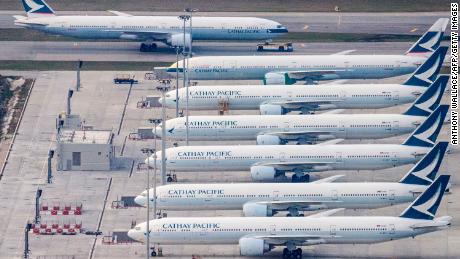 Cathay Pacific planes are seen parked on the tarmac in Hong Kong.