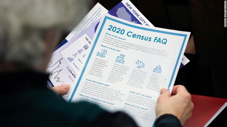 A person holds census information handed out at an event in New York City on February 22.