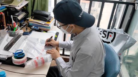 Henan province resident Andy Li packages HIV drugs for coronavirus sufferers who can use the medicine to treat their disease.