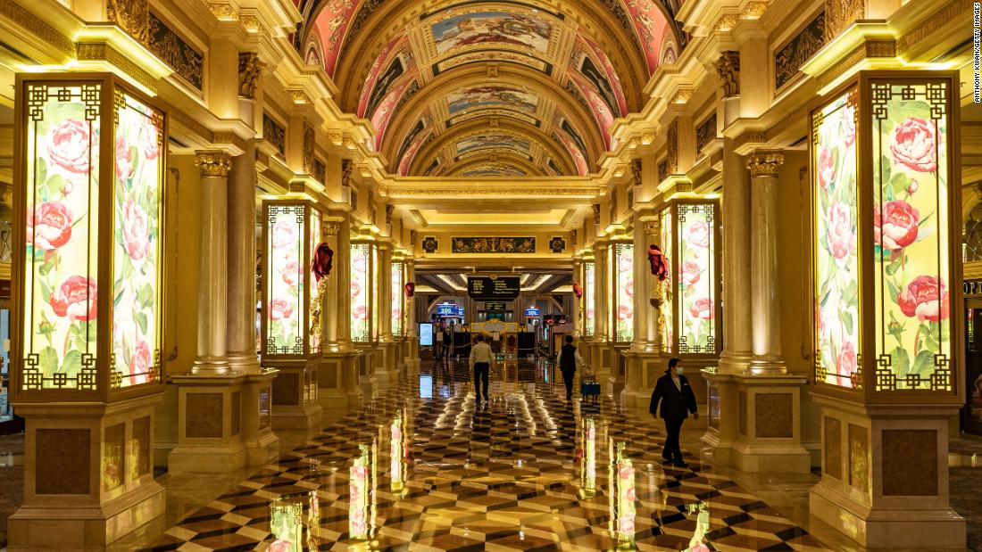 Staff members walk inside the Venetian Macau after it closed its casino on February 5.