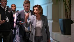 Speaker of the House Nancy Pelosi, D-Calif., walks to a meeting with her Democratic caucus as House moves toward passage of a coronavirus aid package on Capitol Hill in Washington, Wednesday, March 11, 2020. 