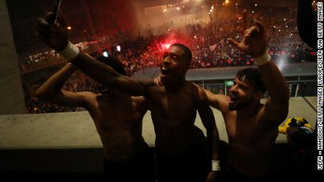 PSG players, including Presnel Kimpembe and Juan Bernat, celebrate defeating Borussia Dortmund in the Champions League at the Parc des Princes, a match that was played behind closed doors.