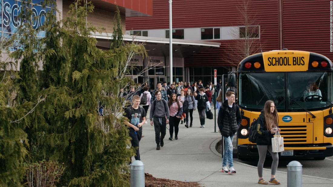 Students leave Glacier Peak High School in Snohomish, Washington, on March 12. Beginning the following day, schools in the Snohomish school district planned to be closed through April 24.