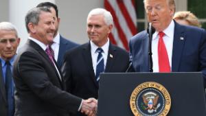 Brian Cornell, Chairman and CEO of Target Corporation shakes hands with US President Donald Trump at a press conference on COVID-19, known as the coronavirus, in the Rose Garden of the White House in Washington, DC, March 13, 2020. - Trump is declaring coronavirus a national emergency. (Photo by SAUL LOEB / AFP) (Photo by SAUL LOEB/AFP via Getty Images)