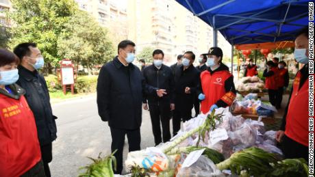 Chinese President Xi Jinping visits a residential community in Wuhan, on March 10.