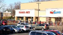 Long lines form outside a Trader Joes in Millburn, New Jersey, on March 14, 2020.