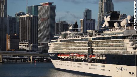 The Celebrity Infinity cruise ship returns to  port in Miami from the Caribbean as cruise lines suspend operations on March 14, 2020.