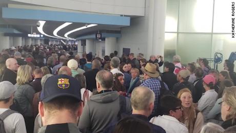 Airport travelers waited hours in screening lines over the weekend.