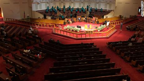 The choir sings during services on at St. Philip African Methodist Episcopal Church in Atlanta on Sunday, March 15, 2020. Only about 100 people filled a sprawling sanctuary that seats more than a thousand at the church because of coronavirus fears. Pastor William Watley told congregants he would follow officials' guidance on whether to continue services after Sunday, calling for prayer during the epidemic. (Jeff Amy/Associated Press)