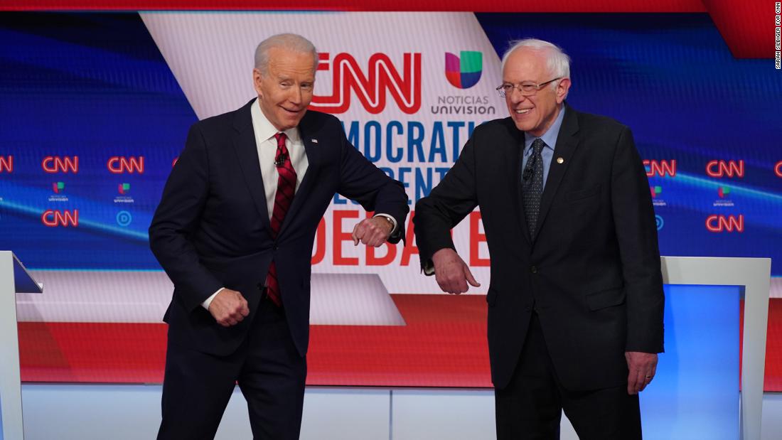Biden greets US Sen. Bernie Sanders with an elbow bump before the start of &lt;a href=&quot;http://www.cnn.com/2020/03/15/politics/gallery/debate-washington-biden-sanders/index.html&quot; target=&quot;_blank&quot;&gt;their one-on-one debate&lt;/a&gt; in Washington, DC, in March 2020. The two Democrats went with an elbow bump instead of a handshake because of the coronavirus pandemic. Sanders ended his presidential campaign the following month, clearing Biden&#39;s path to the Democratic nomination.