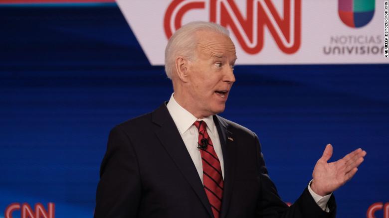 Former Vice President Joe Biden and Vermont Sen. Bernie Sanders participate in the Democratic debate in Washington, on Sunday, March 15.