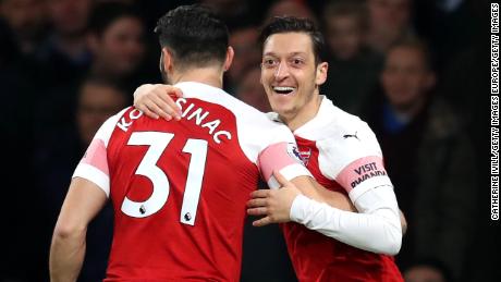 LONDON, ENGLAND - FEBRUARY 27: Mesut Ozil of Arsenal celebrates after scoring his team&#39;s first goal with Sead Kolasinac of Arsenal during the Premier League match between Arsenal FC and AFC Bournemouth at Emirates Stadium on February 27, 2019 in London, United Kingdom. (Photo by Catherine Ivill/Getty Images)