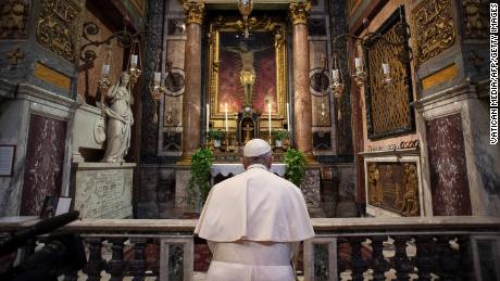 Pope Francis prays ast San Marcello al Corso church in Rome, home to a crucifix which believers say helped to end an outbreak of the plague in 1522.