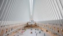 The Oculus at the World Trade Center&#39;s transportation hub is sparsely occupied, Monday, March 16, 2020 in New York. Millions of Americans have begun their work weeks holed up at home, as the coronavirus pandemic means the entire nation&#39;s daily routine has shifted in ways never before seen in U.S. history. (AP Photo/Mark Lennihan)