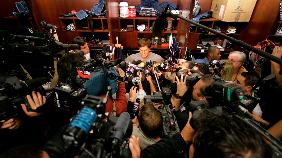 Brady is surrounded by the media in 2007. The Patriots went undefeated in the regular season but lost to the New York Giants in the Super Bowl.