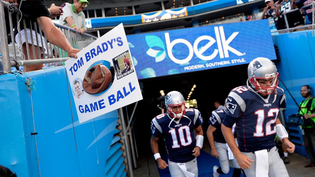 An opposing fan taunts Brady as he takes the field in August 2015. Brady was eventually suspended four games over the &quot;Deflategate&quot; controversy, which involved allegations that the Patriots purposely deflated balls to gain an advantage on offense in an AFC Championship game.