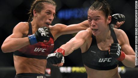 Weili Zhang punches Joanna Jedrzejczyk during UFC 248, the last UFC event to take place in front of fans.