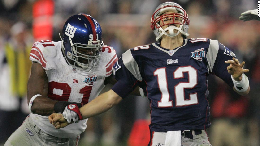 New York Giants defensive end Justin Tuck strips the ball from Brady during the Super Bowl in February 2008.