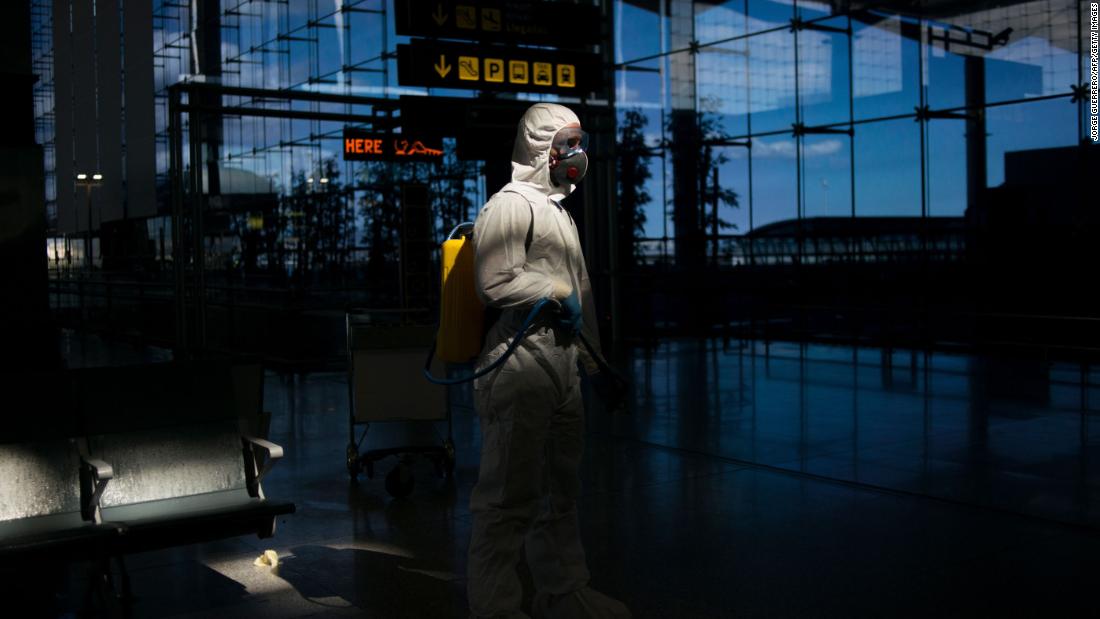 A member of Spain&#39;s Military Emergencies Unit carries out a general disinfection at the Malaga airport on March 16.