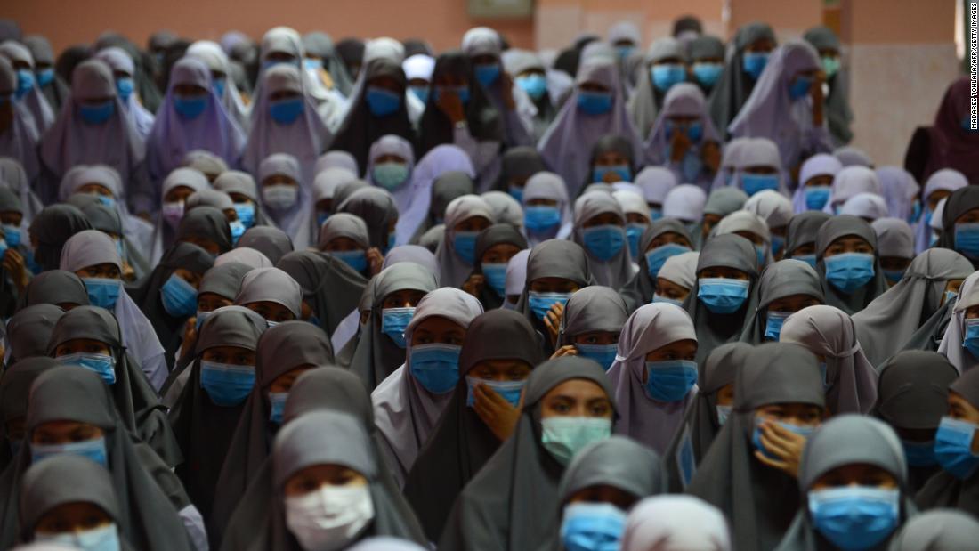 Students at the Attarkiah Islamic School wear face masks during a ceremony in Thailand&#39;s southern province of Narathiwat.