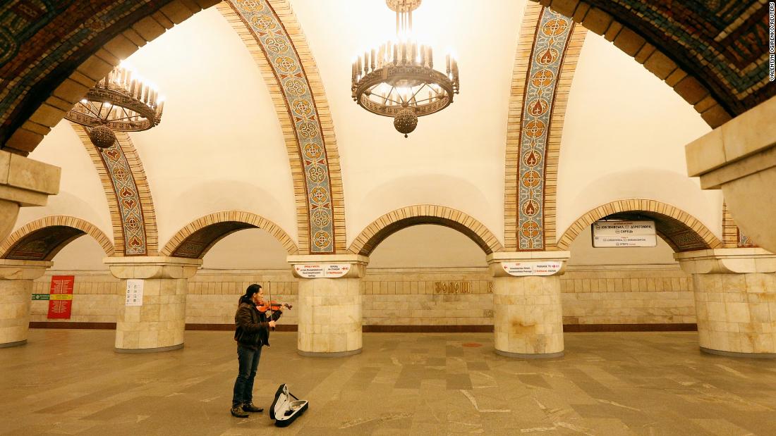A musician plays the violin on March 17 at a train station in Kiev, Ukraine.
