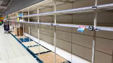 TOPSHOT - This picture taken on March 14, 2020, shows empty stalls in a supermarket in Brussels, during the COVID-19 outbreak caused by the novel coronavirus. - Belgium close schools, cancel all cultural events and shutter bars and restaurants to stave off the spread of the coronavirus outbreak.  Beginning on March 14, only stores that provide essential services, such as pharmacies and grocery stores, will remain open under normal conditions. (Photo by François WALSCHAERTS / AFP) (Photo by FRANCOIS WALSCHAERTS/AFP via Getty Images)