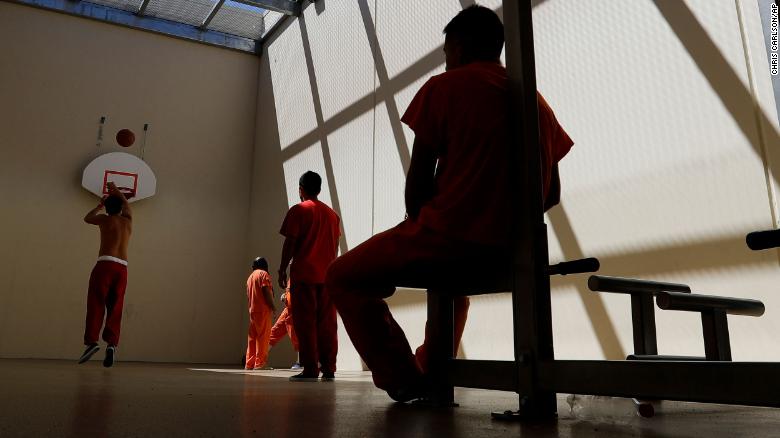 In this Aug. 28, 2019, file photo, detainees exercise at the Adelanto ICE Processing Center in Adelanto, California.