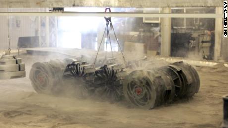 The Regolith Advanced Surface Systems Operations Robot goes through a test in the regolith bin.