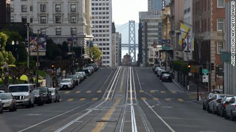 California Street, usually filled with iconic cable cars, is seen mostly empty in San Francisco, California on March 17, 2020. - Millions of San Francisco area residents last Monday were ordered to stay home to slow the spread of the deadly coronavirus as part of a lockdown effort covering a section of California including Silicon Valley. 