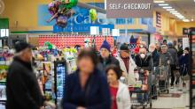Shoppers wait in the checkout line at a Stop &amp; Shop supermarket on Thursday, March 19, 2020, in North Providence, Rhode Island. 