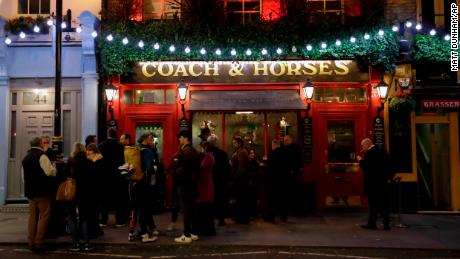 The crowds still gather in London, here in a pub in Covent Garden, a popular tourist area. 