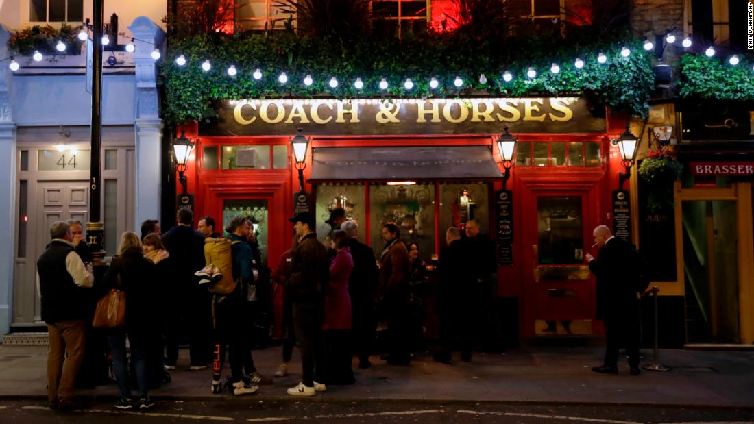 Crowds still gather in London, here at a pub in Covent Garden, a popular tourist area. 