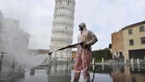 PISA, ITALY - MARCH 17:  A worker carries out sanitation operations for the Coronavirus emergency in Piazza dei Miracoli near to the Tower of Pisa in a deserted town on March 17, 2020 in Pisa, Italy. The sanitization service is carried out by four teams in all the districts of the city of Pisa, to sanitize the squares, streets, public areas, sidewalks, surfaces exposed to the contact of large flows of people. Italian government has imposed unprecedented restrictions on its 60 million people as it expanded its emergency Coronavirus (Covid-19) lockdown nationwide. The number of confirmed Covid-19 cases in Italy has passed 31,500 with the death toll rising to 2503.  (Photo by Laura Lezza/Getty Images)