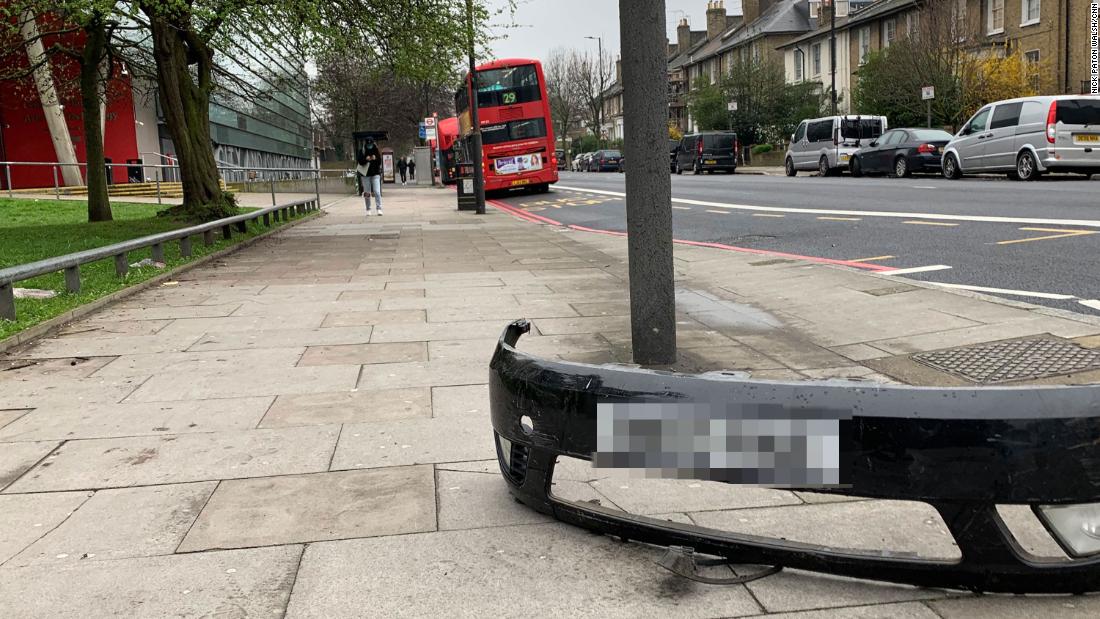 The fender of a car, just left on a street, seems to be a symbol of the times. CNN blurred the license plate.