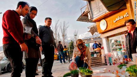 People view items for sale ahead of Nowruz outside the Tajrish Bazaar in Iran's capital Tehran on March 12, 2020.