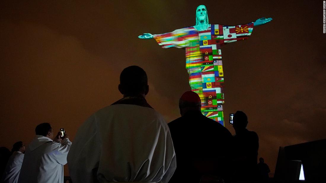 A Mass in Rio de Janeiro honors coronavirus victims around the world on March 18. Brazil&#39;s Christ the Redeemer statue &lt;a href=&quot;http://www.cnn.com/travel/article/coronavirus-rio-christ-the-redeemer-trnd/index.html&quot; target=&quot;_blank&quot;&gt;was lit up with flags and messages of hope&lt;/a&gt; in solidarity with countries affected by the pandemic.